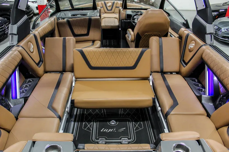 Slide: The Image of Luxurious interior of 2021 Tigé 25ZX boat with tan leather seating and modern design. - 28
