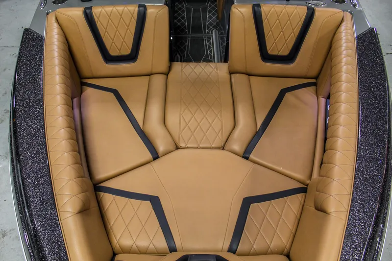 Slide: The Image of Luxurious tan leather seating in 2021 Tigé 25ZX boat interior. - 29