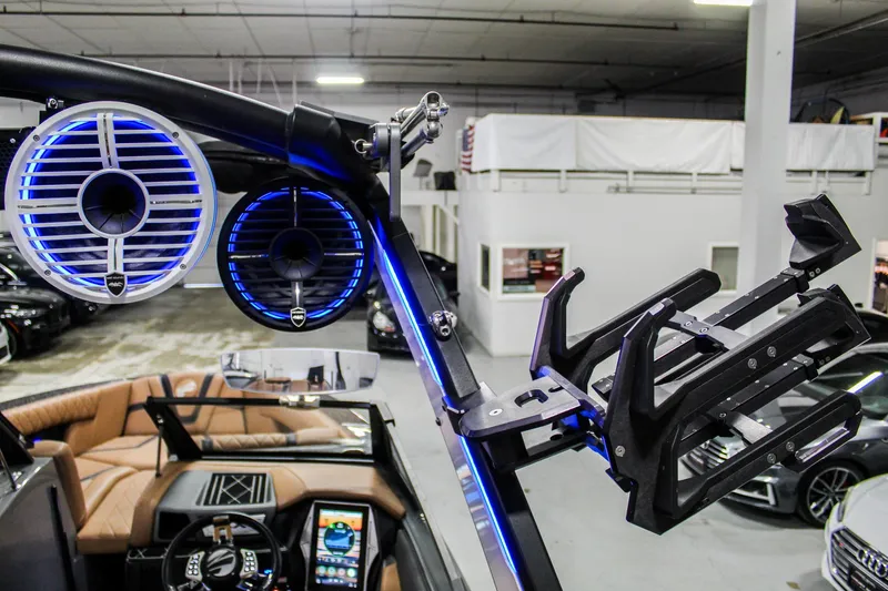 Slide: The Image of 2021 Tigé 25ZX boat interior with illuminated speakers and wakeboard rack. - 35