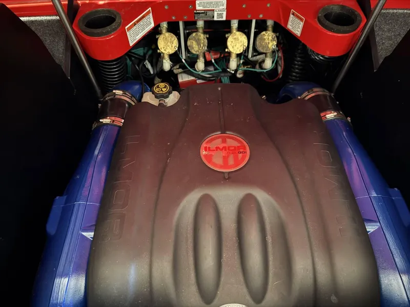 Slide: The Image of 2020 MasterCraft X26 engine compartment with Ilmor branding, showcasing mechanical components. - 11