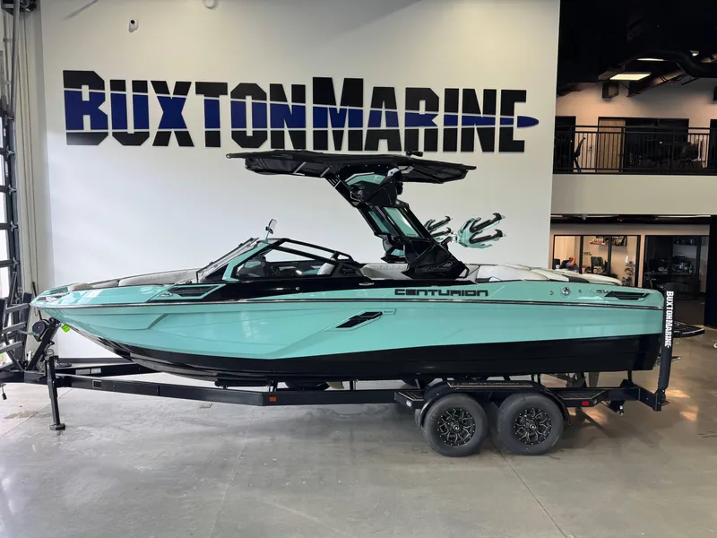 Slide: The Image of 2024 Centurion RI 245 boat on trailer at Buxton Marine showroom. - 1