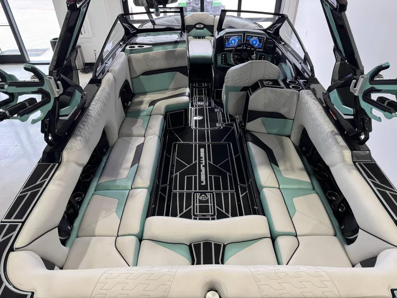 Slide: The Image of 2024 Centurion RI 245 boat interior with modern seating and advanced dashboard controls. - 13