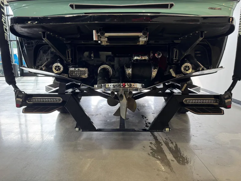 Slide: The Image of 2024 Centurion RI 245 boat rear view showcasing propeller and underwater gear. - 7