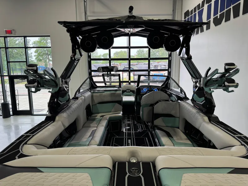 Slide: The Image of 2024 Centurion RI 245 boat interior with modern seating and advanced dashboard features. - 9