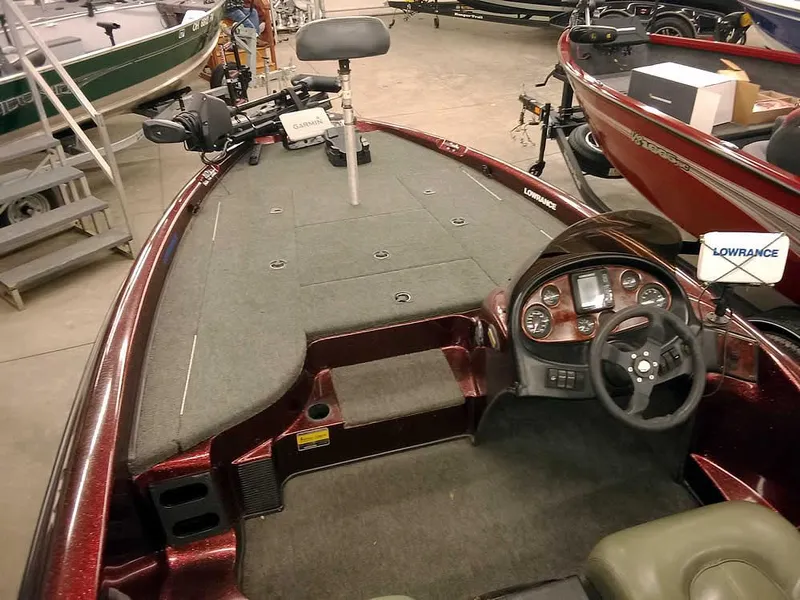 Slide: The Image of 2001 Triton TR186 SC boat interior with steering wheel and fishing deck. - 12