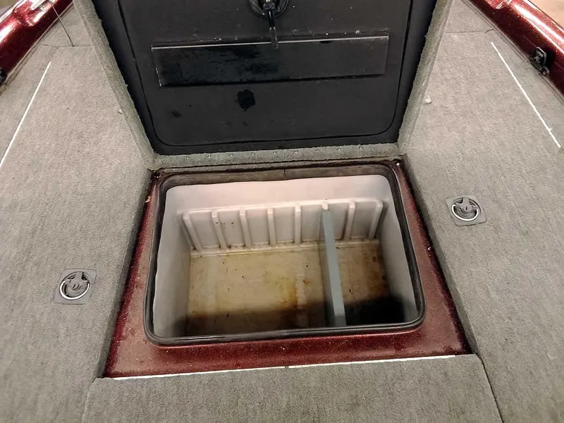 Slide: The Image of Open storage compartment on a 2001 Triton TR186 SC boat deck. - 13