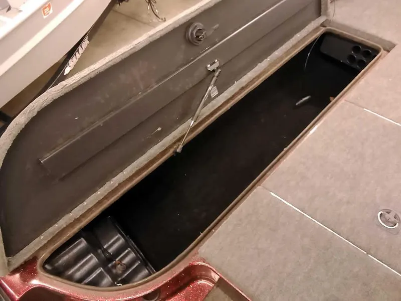 Slide: The Image of Open storage compartment in a 2001 Triton TR186 SC boat. - 15