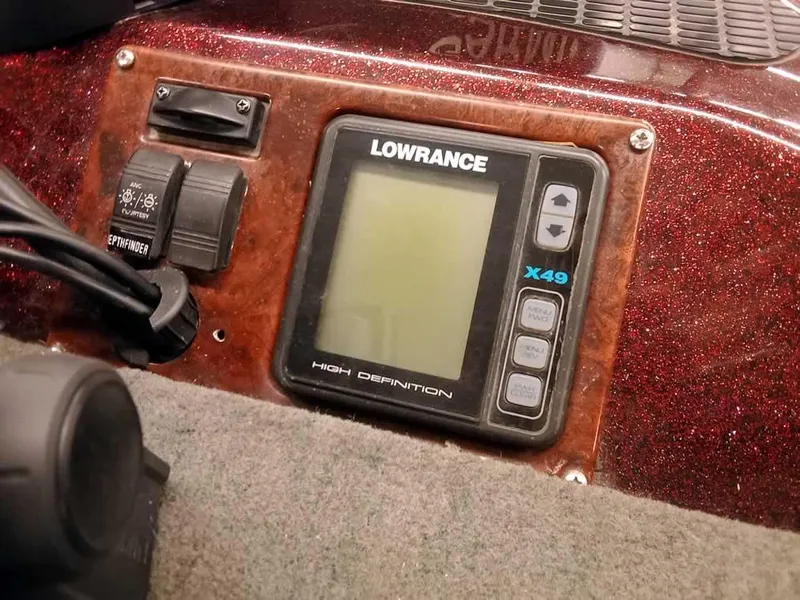 Slide: The Image of Lowrance X49 fish finder on 2001 Triton TR186 sc boat dashboard. - 17