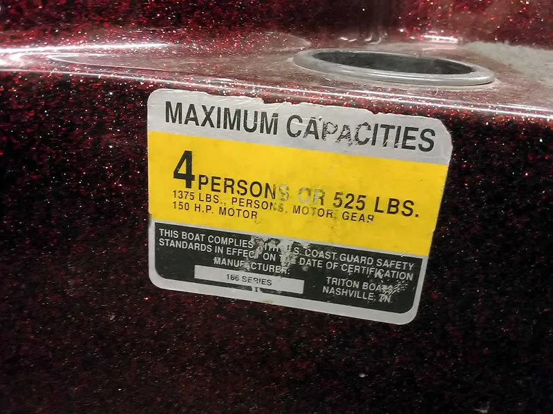 Slide: The Image of 2001 Triton TR186 sc boat capacity label, max 4 persons or 525 lbs, 150 HP motor. - 21