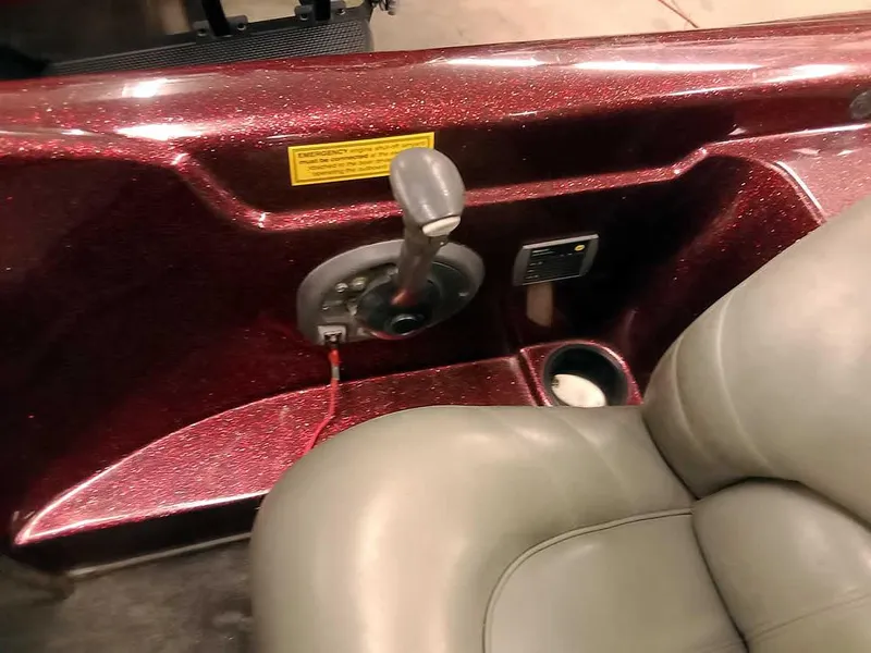 Slide: The Image of 2001 Triton TR186 sc boat interior with gear shift and gray seat. - 23