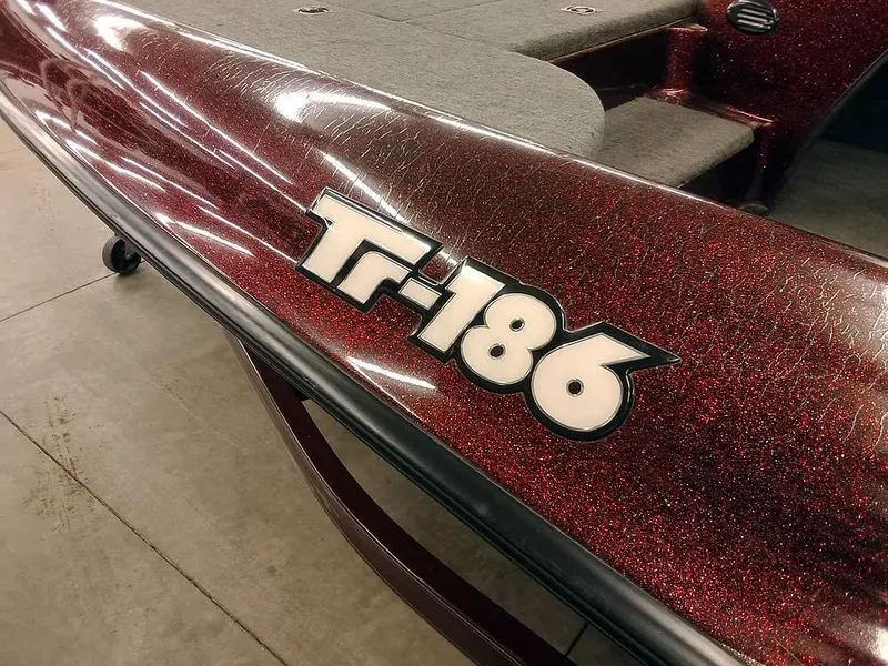 Slide: The Image of 2001 Triton TR186 SC boat with glittery red finish and model decal. - 4