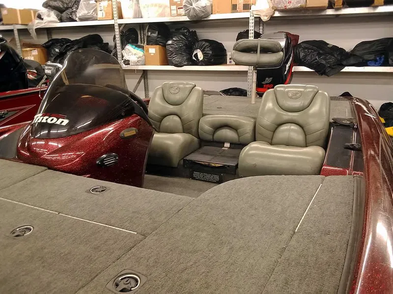 Slide: The Image of 2001 Triton TR186 SC boat interior with gray seats in storage. - 8