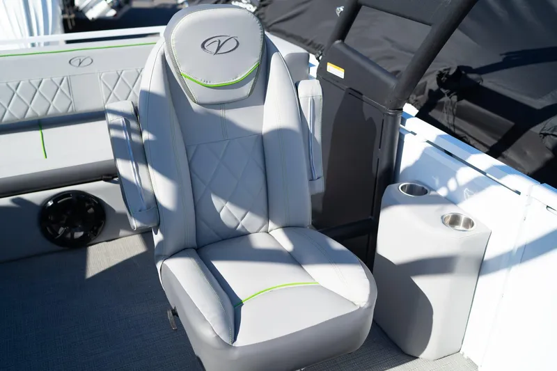 Slide: The Image of 2024 Veranda Vertex 25RL boat seat with cup holders, featuring gray upholstery and green accents. - 10