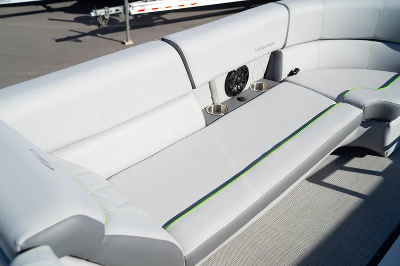 Slide: The Image of 2024 Veranda Vertex 25RL boat interior with sleek seating and cup holders. - 11