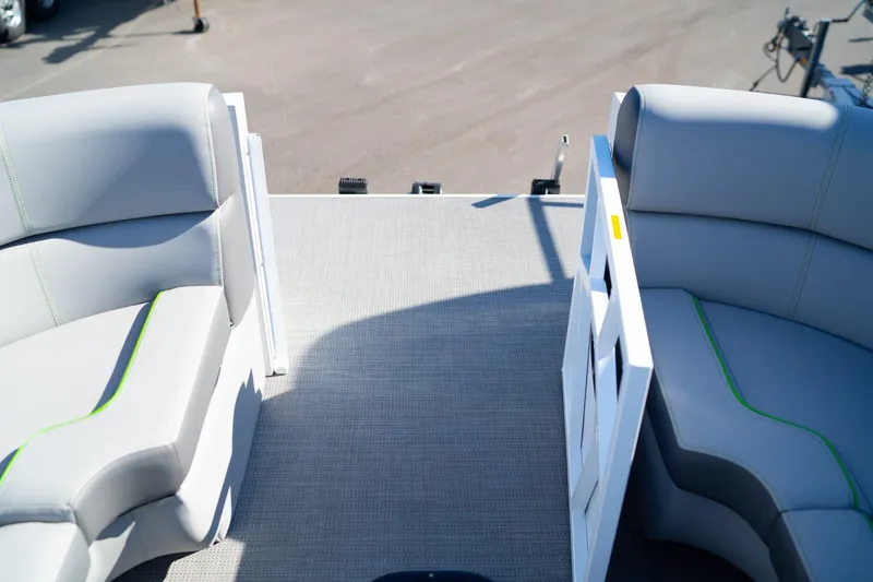 Slide: The Image of 2024 Veranda Vertex 25RL boat interior with gray seating and green accents. - 13