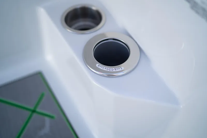 Slide: The Image of 2024 Veranda Vertex 25RL boat cup holders with sleek design and stainless steel accents. - 15