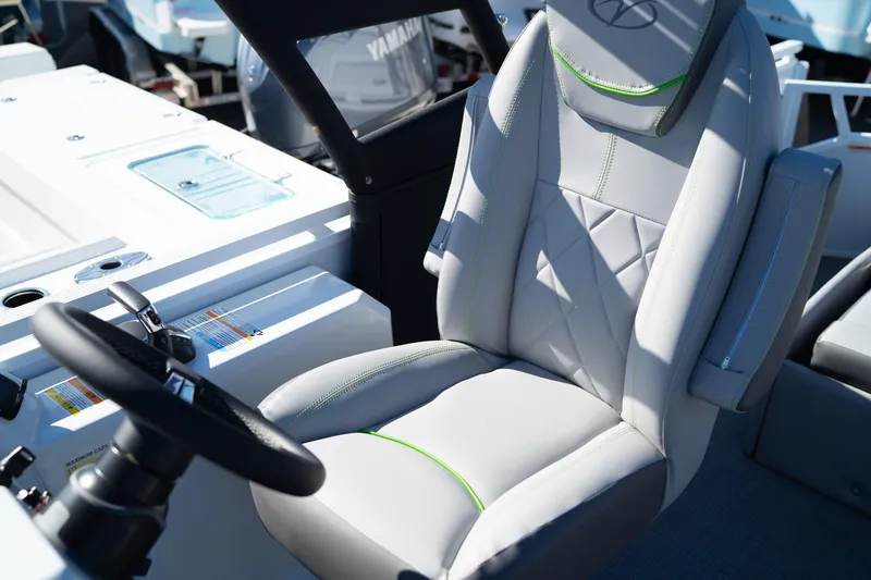 Slide: The Image of 2024 Veranda Vertex 25RL boat captain's seat with modern design and steering wheel. - 9