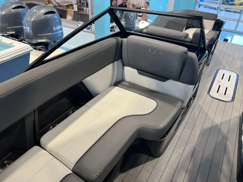 Slide: The Image of 2024 Veranda V One 25 boat interior with gray and white seating. - 12