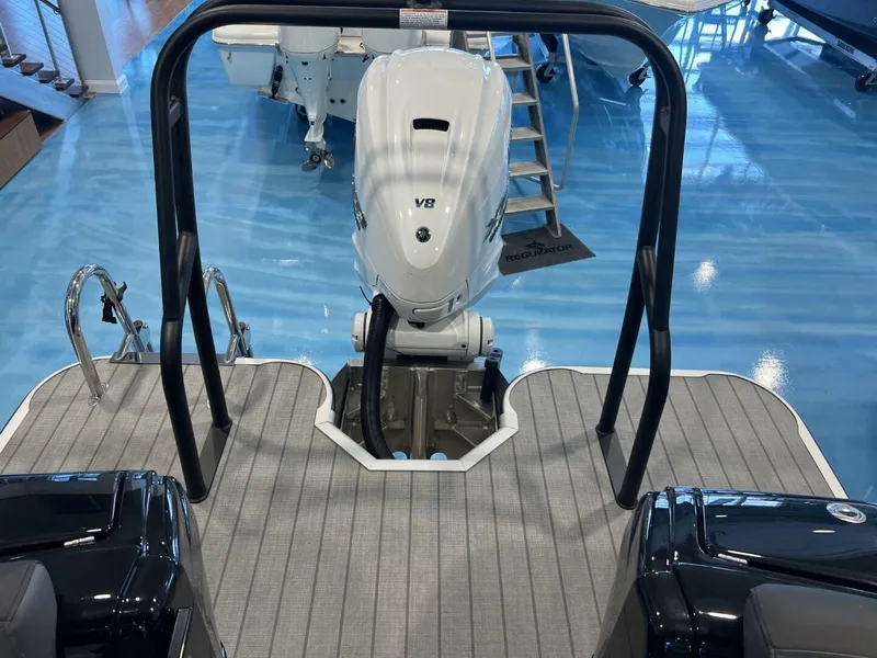 Slide: The Image of 2024 Veranda V One 25 boat with V8 engine on display indoors. - 13