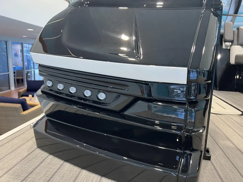 Slide: The Image of 2024 Veranda V One 25 boat with sleek black design and modern lighting features. - 6