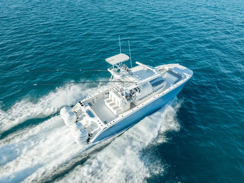 Slide: The Image of 2023 Invincible 37 Catamaran cruising on open blue waters. - 12