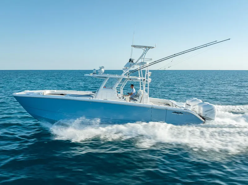 Slide: The Image of 2023 Invincible 37 Catamaran cruising on open sea, showcasing sleek design and powerful performance. - 14