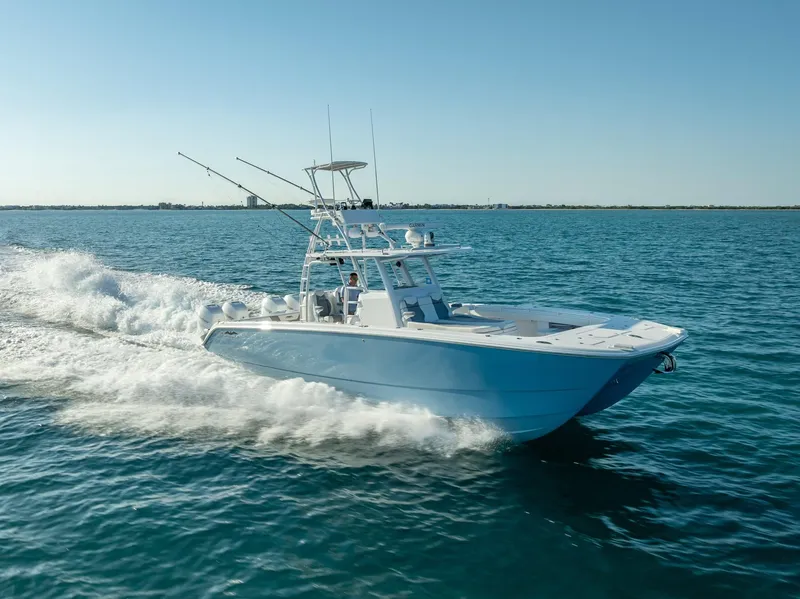 Slide: The Image of 2023 Invincible 37 Catamaran cruising on open water, showcasing sleek design and performance. - 17