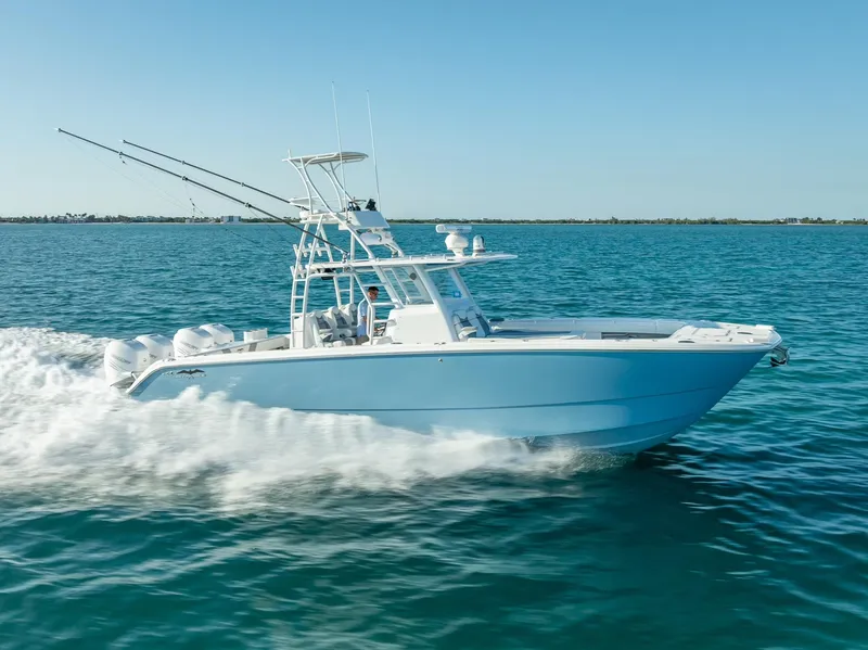 Slide: The Image of 2023 Invincible 37 Catamaran cruising on open water, showcasing sleek design and powerful performance. - 19