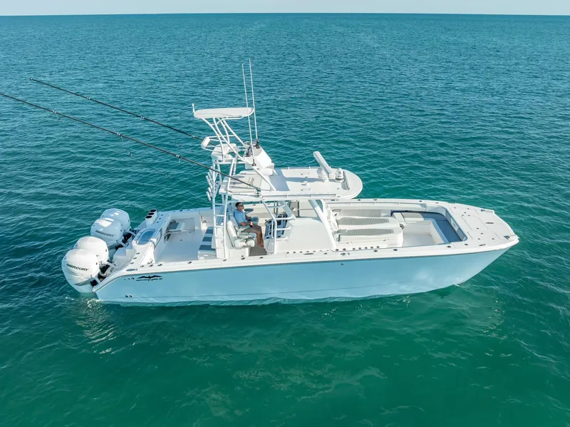 Slide: The Image of 2023 Invincible 37 Catamaran on open water, showcasing sleek design and powerful engines. - 22