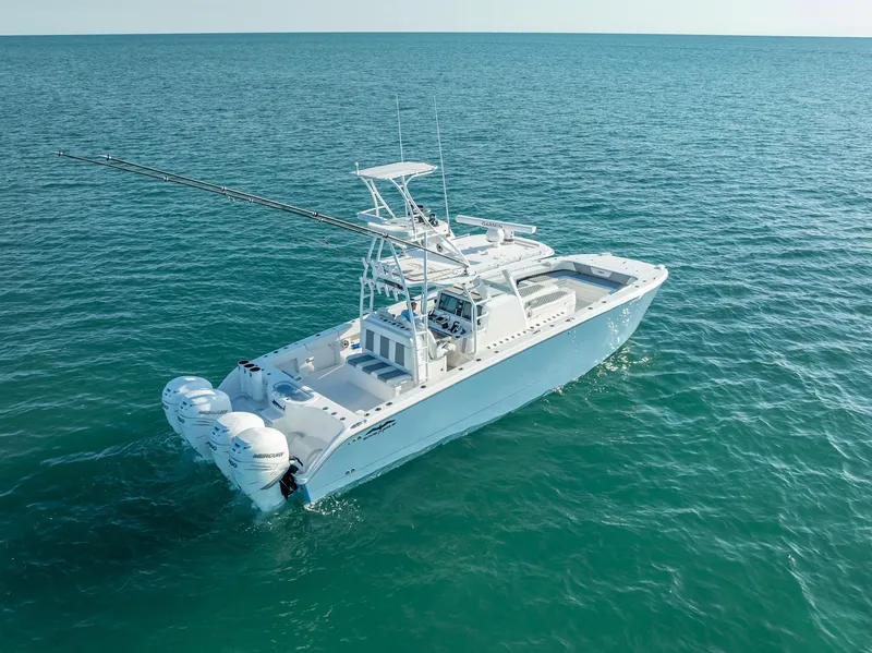 Slide: The Image of 2023 Invincible 37 Catamaran on open sea, showcasing sleek design and powerful engines. - 23