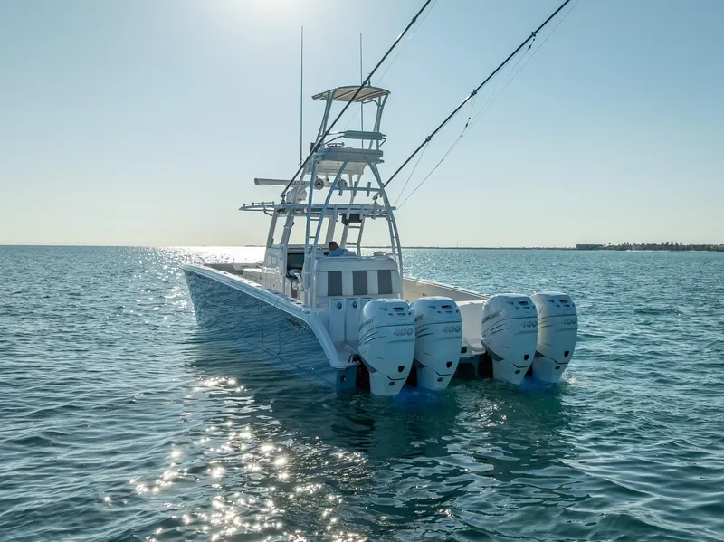 Slide: The Image of 2023 Invincible 37 Catamaran with four engines on open water. - 25