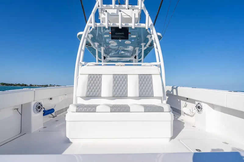 Slide: The Image of 2023 Invincible 37 Catamaran with sleek seating and modern design on open water. - 38