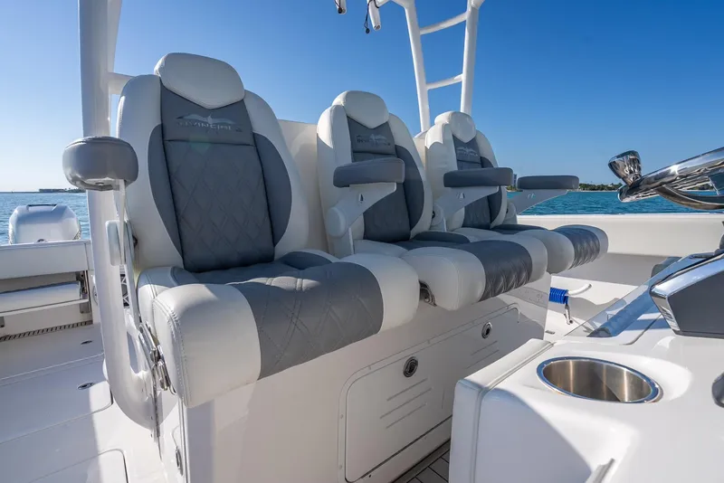 Slide: The Image of Luxury seating on 2023 Invincible 37 Catamaran, featuring plush, ergonomic design and ocean backdrop. - 47