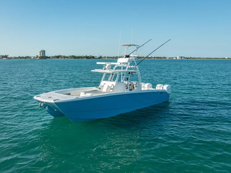 Slide: The Image of 2023 Invincible 37 Catamaran on clear blue water, showcasing sleek design and fishing capabilities. - 8