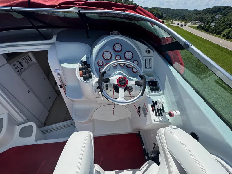 Slide: The Image of Cockpit of a 2002 Baja .38 Special boat with steering wheel and gauges. - 6