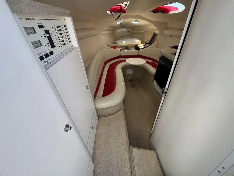 Slide: The Image of 2002 Baja .38 Special boat interior with red and white seating, control panel, and table. - 7