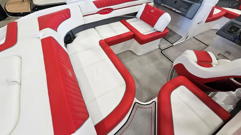 Slide: The Image of 2020 Cobalt CS22 boat interior with red and white seating, showcasing luxury and comfort. - 10