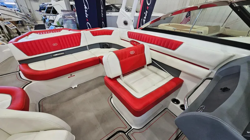 Slide: The Image of 2020 Cobalt CS22 boat interior with red and white seating, showcasing luxury design. - 11