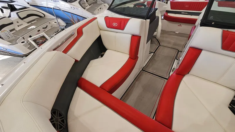 Slide: The Image of 2020 Cobalt CS22 boat interior with red and white seating, showcasing luxury design. - 18