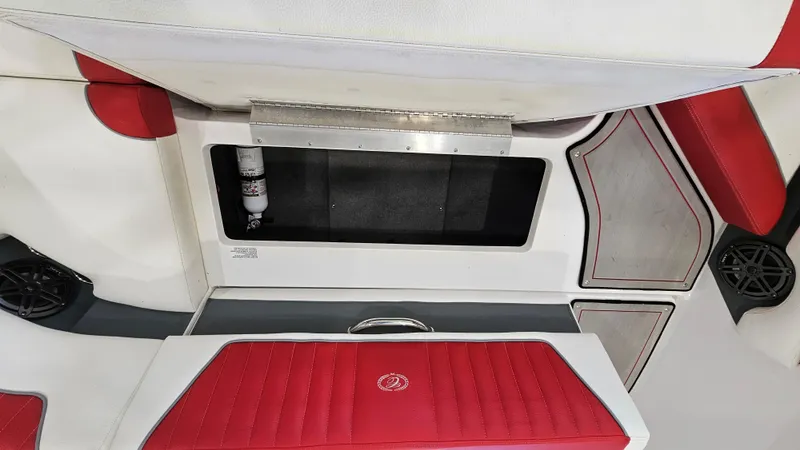 Slide: The Image of Interior of a 2020 Cobalt CS22 boat with red and white seating. - 23