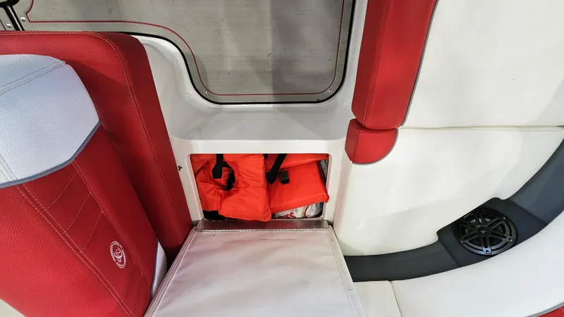Slide: The Image of Red and white interior of 2020 Cobalt CS22 boat with life jackets stored. - 24