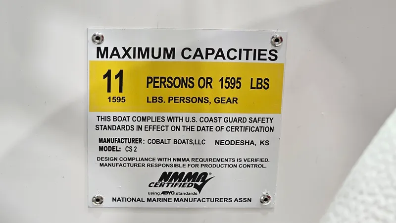 Slide: The Image of Maximum capacity label for 2020 Cobalt CS22 boat, 11 persons or 1595 lbs. - 27