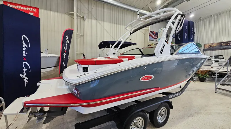 Slide: The Image of 2020 Cobalt CS22 boat on trailer in showroom, featuring sleek design and vibrant colors. - 4