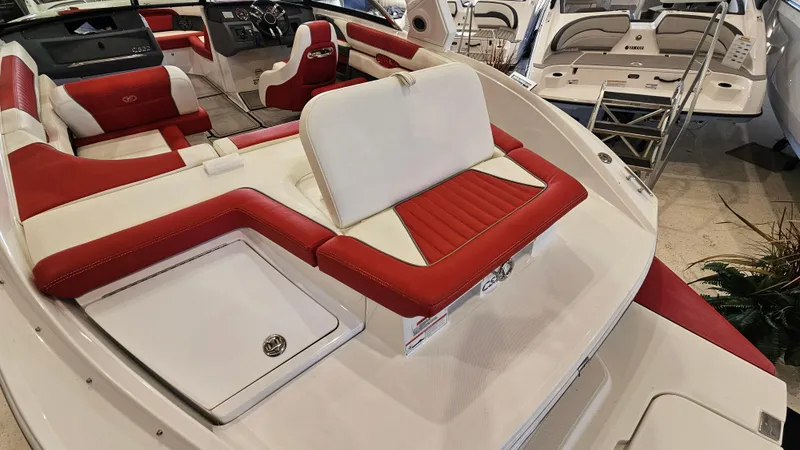 Slide: The Image of 2020 Cobalt CS22 boat interior with red and white seating, showcasing luxury design. - 8