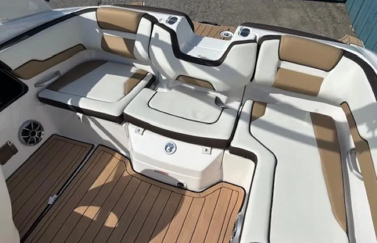 Slide: The Image of 2022 Yamaha Boats 195S interior with cushioned seating and teak-style flooring. - 23
