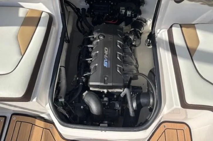 Slide: The Image of 2022 Yamaha Boats 195S engine compartment with visible components and seating area. - 27