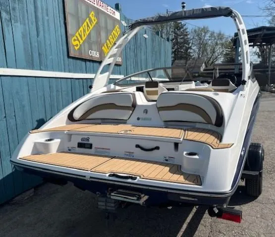 Slide: The Image of 2022 Yamaha Boats 195S on trailer at Sizzle Marine dealership. - 4