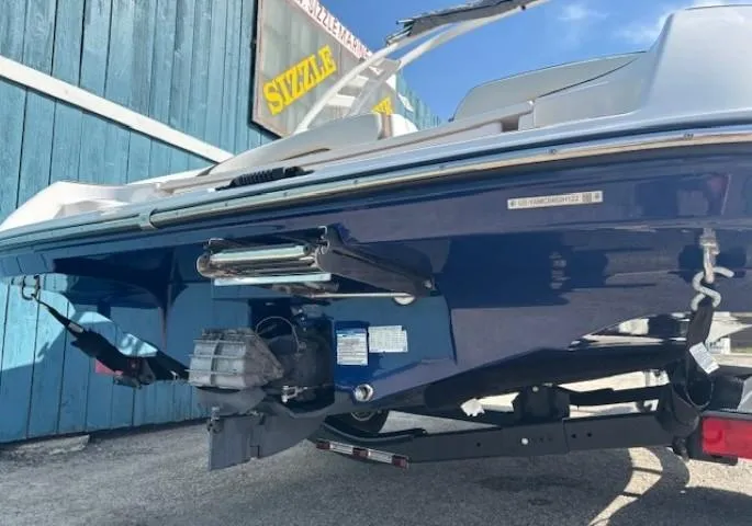 Slide: The Image of 2022 Yamaha Boats 195S, blue hull, on trailer, outdoor display. - 5