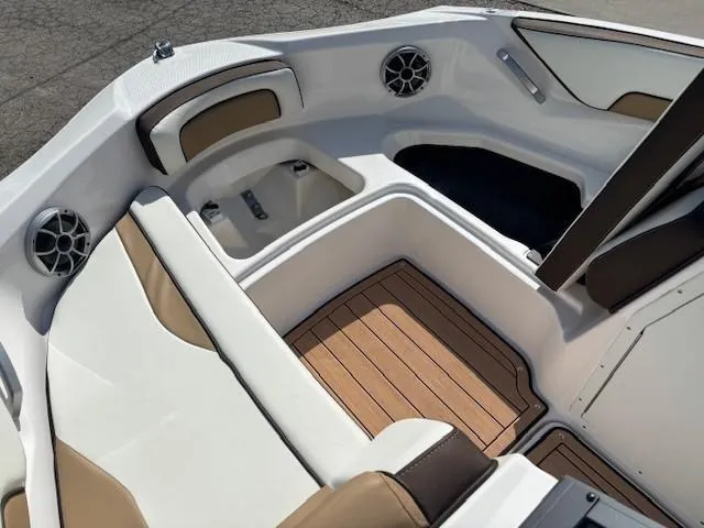 Slide: The Image of 2022 Yamaha Boats 195S interior with cushioned seating and wood-style flooring. - 9
