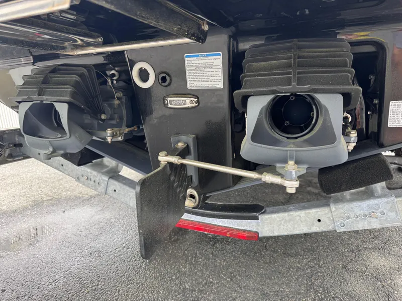 Slide: The Image of 2023 Yamaha Boats 252SE jet propulsion system, showcasing dual engines and steering components. - 6